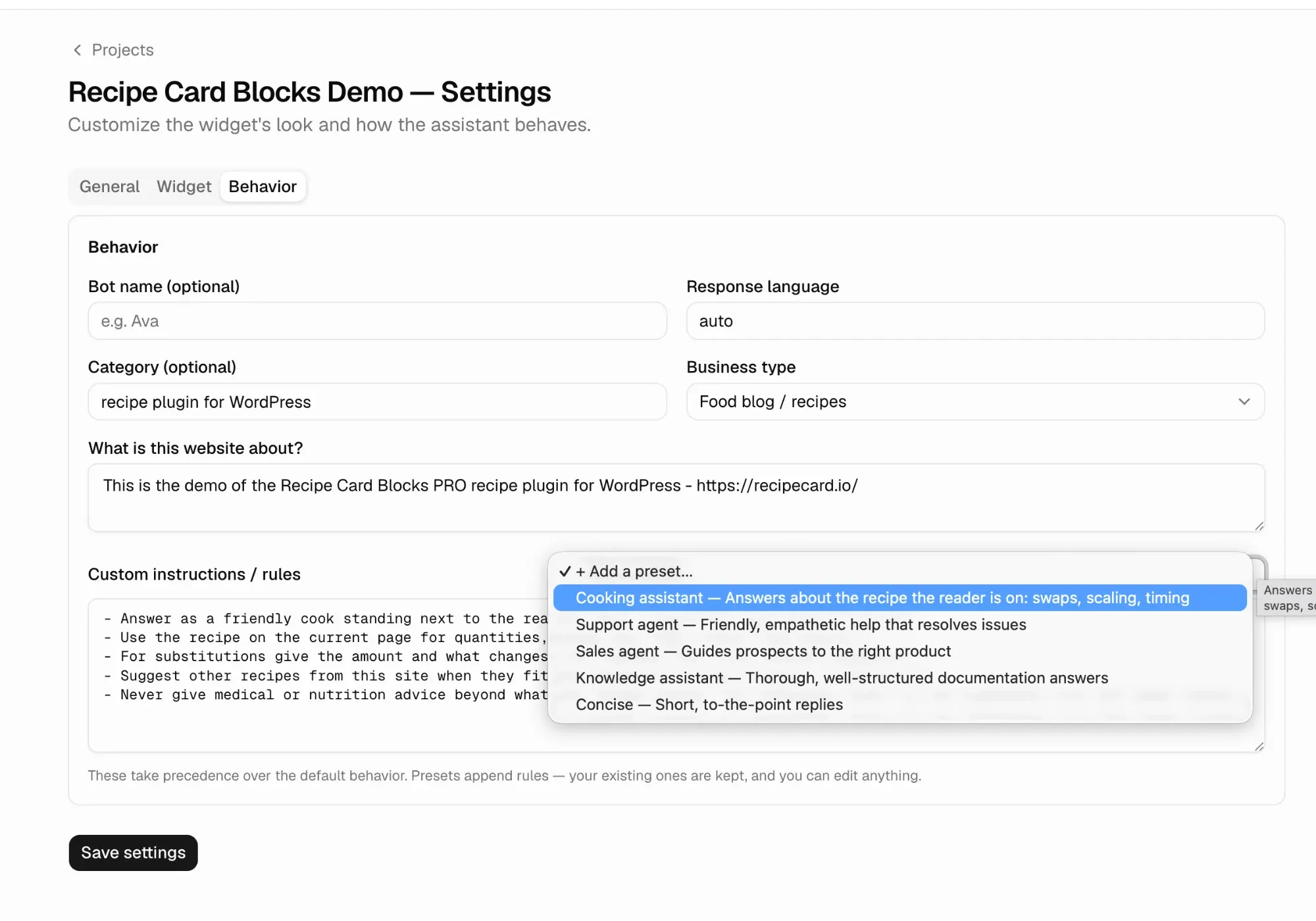 The Behavior tab of a project's settings: Business type set to Food blog / recipes, and the Add a preset menu under Custom instructions open, with Cooking assistant highlighted above Support agent, Sales agent, Knowledge assistant and Concise